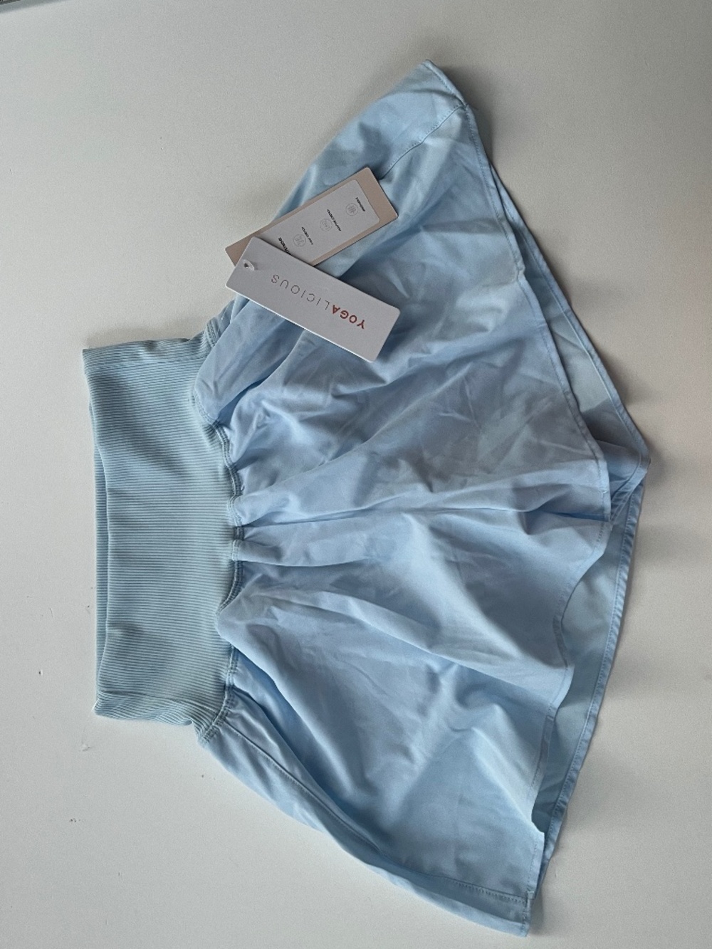 Yogalicious light blue athletic shorts with a wide ribbed waistband size S